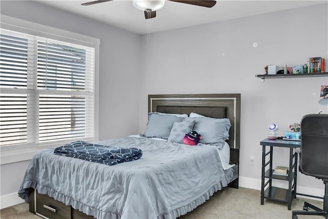 bedroom with light carpet and ceiling fan