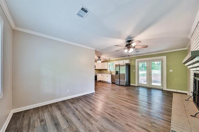 5666 Goldfield Dr, Acworth, GA 30102 - unfurnished living room featuring baseboards, dark wood-style floors, a ceiling fan, and ornamental molding
