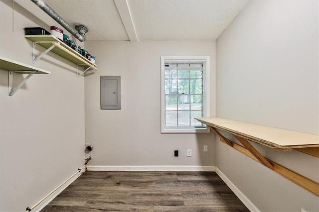 5666 Goldfield Dr, Acworth, GA 30102 - laundry area with electric panel, wood finished floors, baseboards, and a textured ceiling