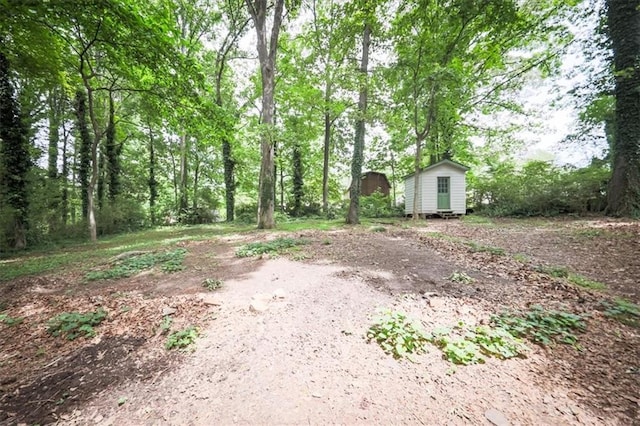 5666 Goldfield Dr, Acworth, GA 30102 - view of yard featuring a storage shed and an outdoor structure