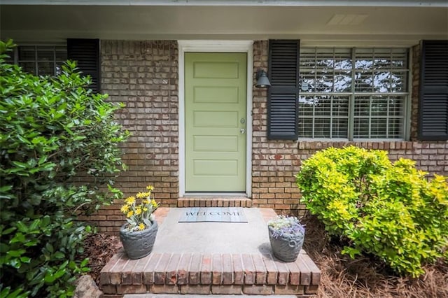 5666 Goldfield Dr, Acworth, GA 30102 - view of exterior entry with brick siding and a porch