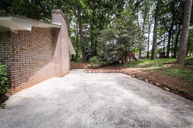 5666 Goldfield Dr, Acworth, GA 30102 - view of patio / terrace featuring a playground and view of scattered trees