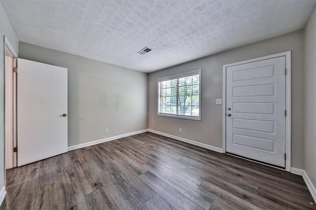 5666 Goldfield Dr, Acworth, GA 30102 - entrance foyer with wood finished floors, baseboards, and a textured ceiling