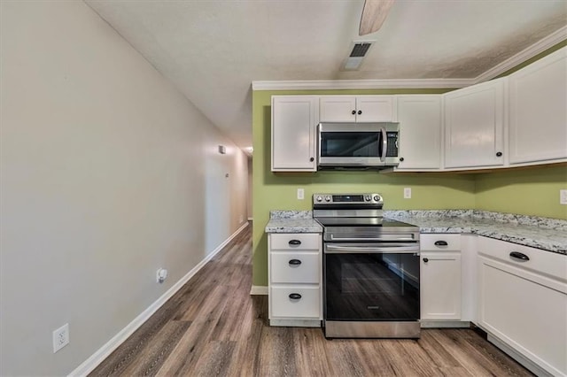 5666 Goldfield Dr, Acworth, GA 30102 - kitchen with appliances with stainless steel finishes, wood finished floors, white cabinetry, baseboards, and light stone counters
