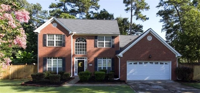 colonial-style house featuring a garage