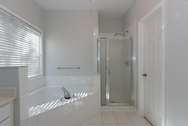 bathroom featuring separate shower and tub and tile patterned flooring