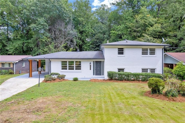 tri-level home with a front yard