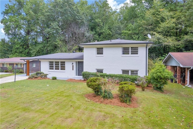 tri-level home with a front yard