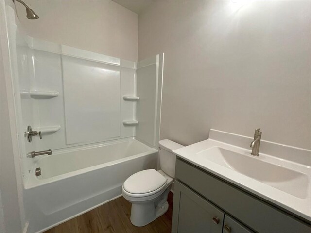 1408 Cozy Ct Unit 303, Atlanta, GA 30315 - full bathroom featuring toilet, vanity, bathtub / shower combination, and wood finished floors