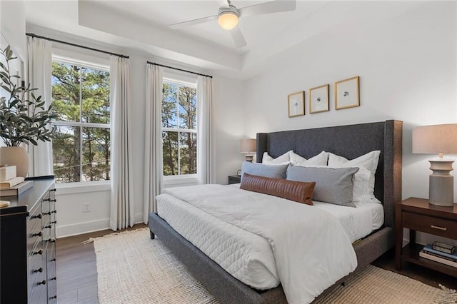 1408 Cozy Ct Unit 303, Atlanta, GA 30315 - bedroom featuring baseboards, a ceiling fan, a tray ceiling, and wood finished floors