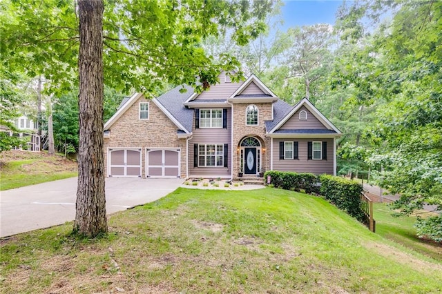 view of front of house featuring a garage and a front yard