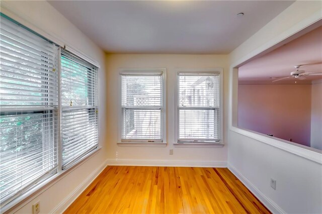 unfurnished room featuring light hardwood / wood-style floors and ceiling fan