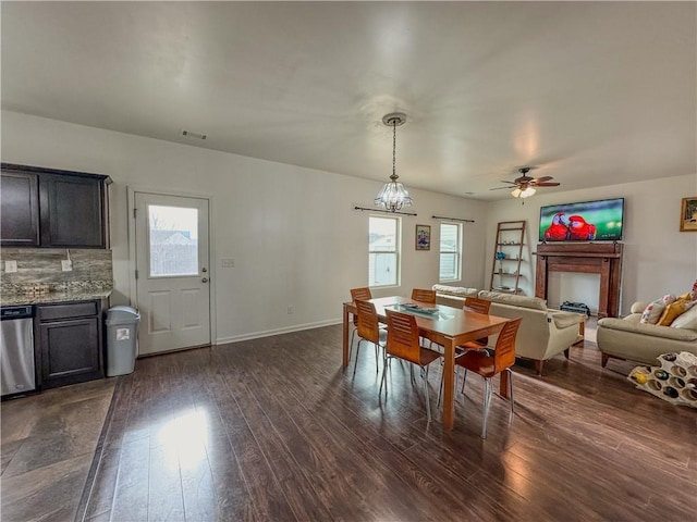 dining room featuring ceiling fan and dark hardwood / wood-style flooring