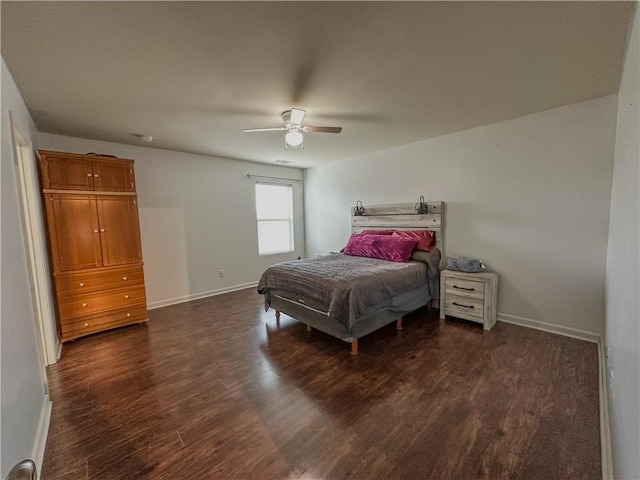 bedroom featuring ceiling fan and dark hardwood / wood-style flooring