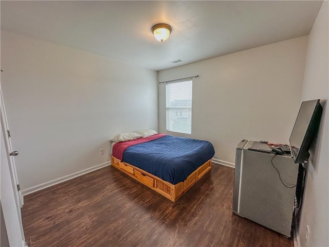 bedroom featuring dark hardwood / wood-style floors