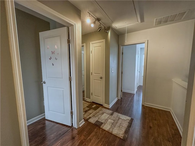 hall with dark hardwood / wood-style flooring