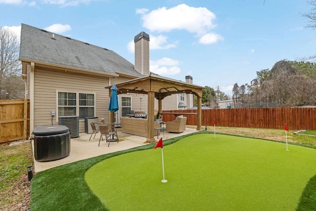 rear view of house featuring an outdoor living space and a patio