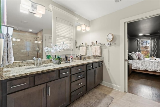 bathroom with vanity, walk in shower, and hardwood / wood-style flooring