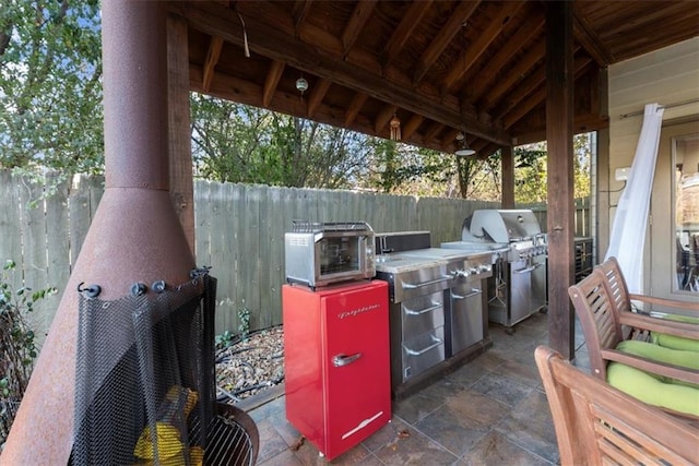 view of patio / terrace featuring a grill and exterior kitchen