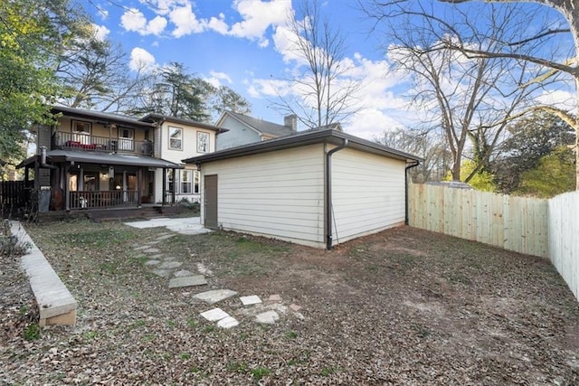 rear view of house with a balcony