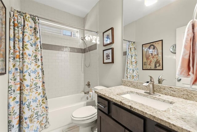 full bathroom featuring toilet, vanity, and shower / bath combo with shower curtain