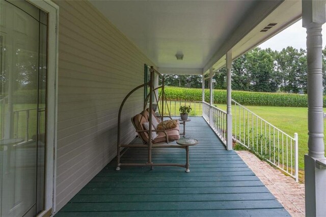 deck featuring a lawn