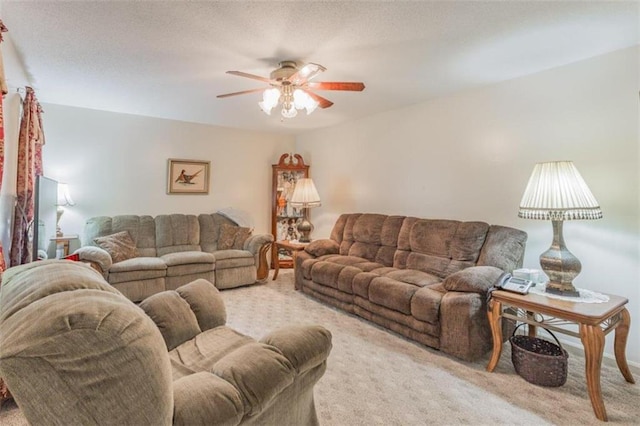 living room featuring light carpet and ceiling fan