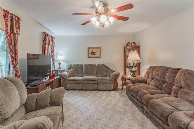 living room with ceiling fan and light carpet