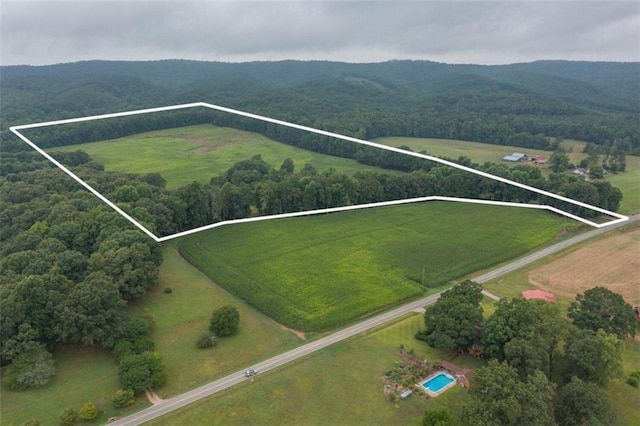 birds eye view of property with a rural view