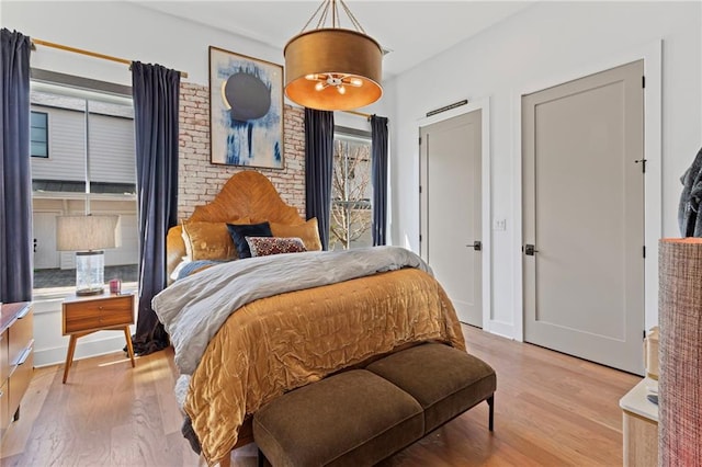 bedroom featuring light wood finished floors