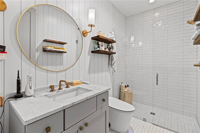 full bath featuring toilet, a shower stall, vanity, and recessed lighting