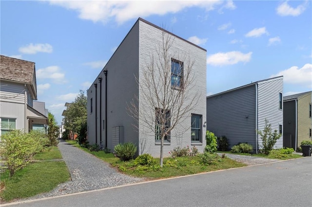 view of property exterior featuring driveway