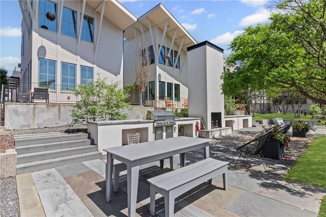 view of patio featuring outdoor dining area and area for grilling