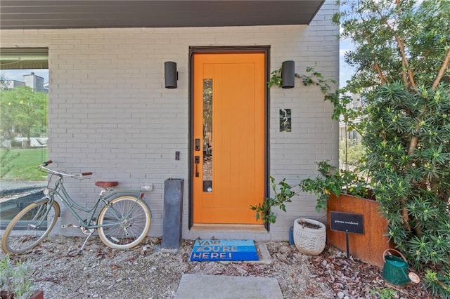 property entrance with brick siding