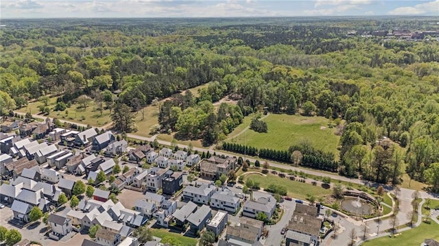 drone / aerial view featuring a view of trees