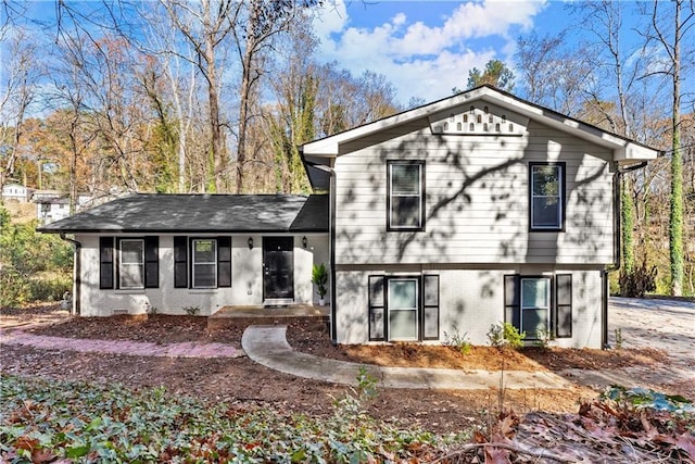 split level home with brick siding