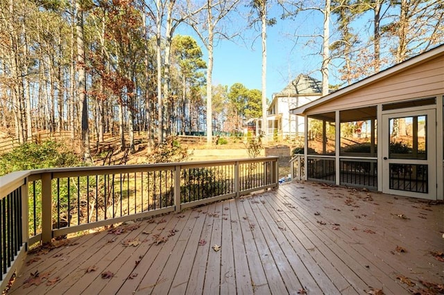 wooden terrace featuring a sunroom