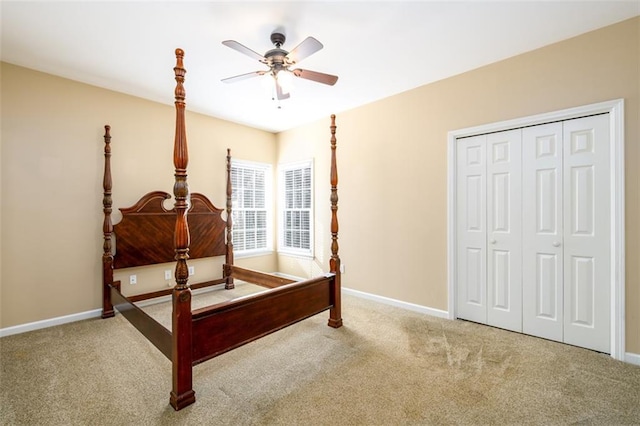 bedroom with carpet, ceiling fan, and a closet