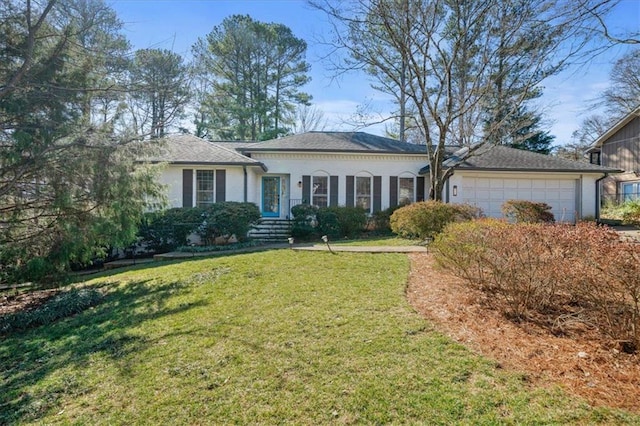 ranch-style home with a garage and a front yard