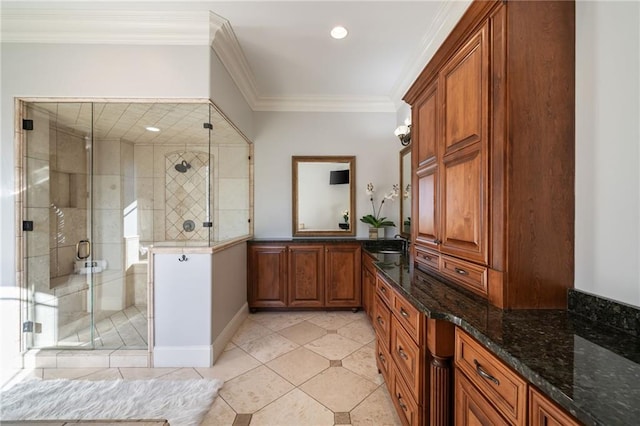 bathroom with ornamental molding, a stall shower, vanity, and tile patterned floors