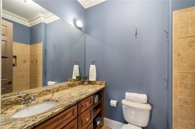 full bath with ornamental molding, vanity, toilet, and baseboards