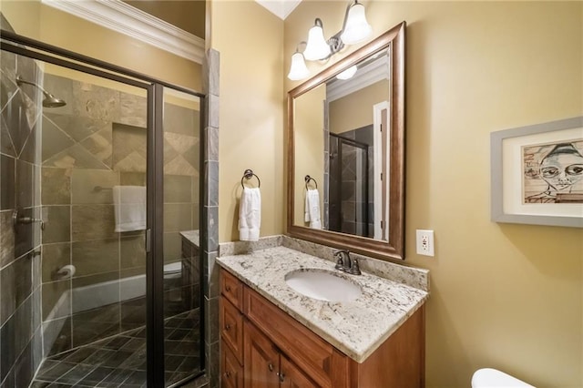 full bath with toilet, vanity, and a shower stall