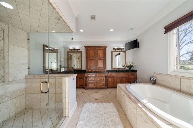 full bathroom with ornamental molding, visible vents, a garden tub, and vanity