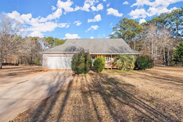 view of front facade with a front yard and a garage