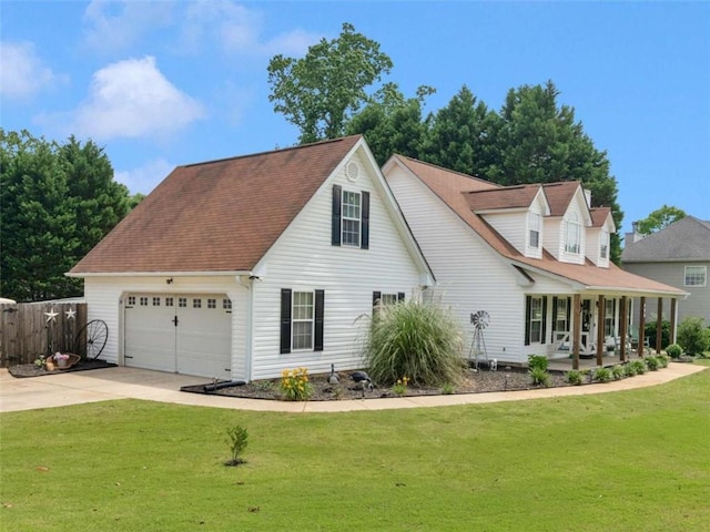 view of front of property with a porch, concrete driveway, and a garage