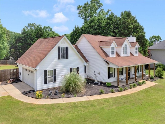 view of front of home featuring a porch, concrete driveway, and an attached garage