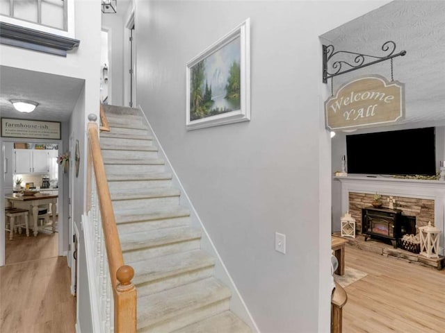 staircase featuring wood finished floors