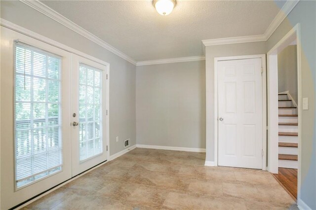802 San Miguel Dr, Stone Mountain, GA 30083 - empty room with french doors, ornamental molding, stairs, baseboards, and a textured ceiling