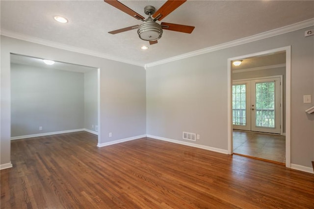 802 San Miguel Dr, Stone Mountain, GA 30083 - spare room featuring ceiling fan, wood finished floors, baseboards, ornamental molding, and recessed lighting