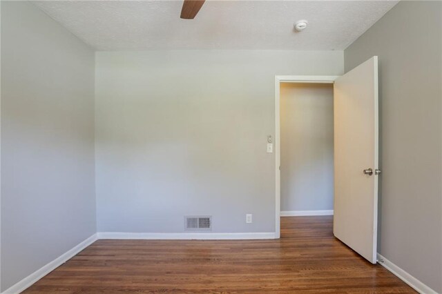 802 San Miguel Dr, Stone Mountain, GA 30083 - empty room featuring wood finished floors, ceiling fan, baseboards, and a smoke detector